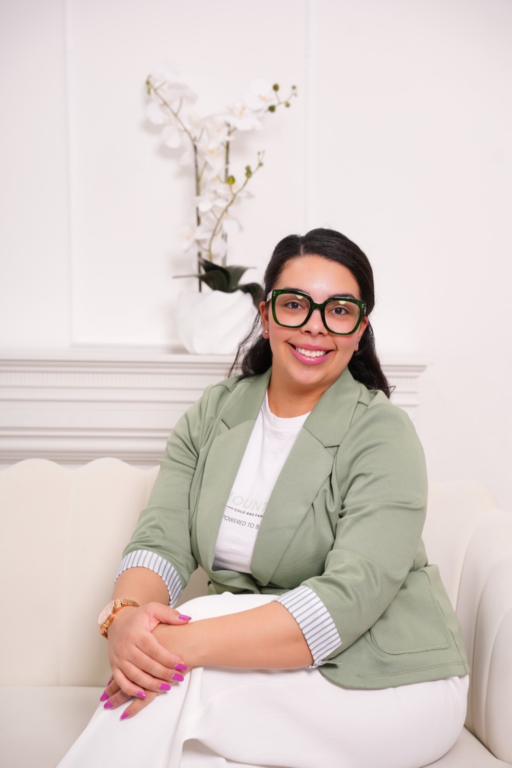 Adina Yankov, Founder and Executive Director, seated in a Mount Etna blazer